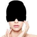 Person wearing a black pain relief mask on a white background