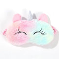 Plush unicorn eye mask with rainbow gradient on a white background