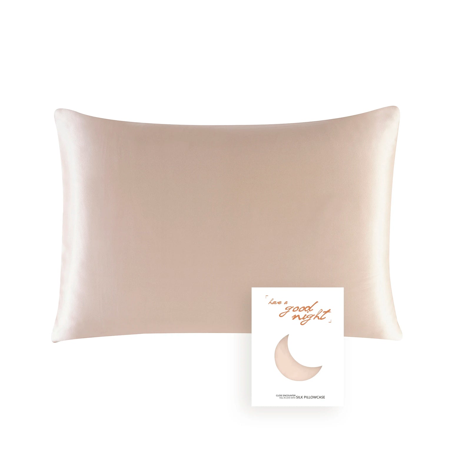 Beige satin pillowcase with a card that says 'Have a good night' on a white background
