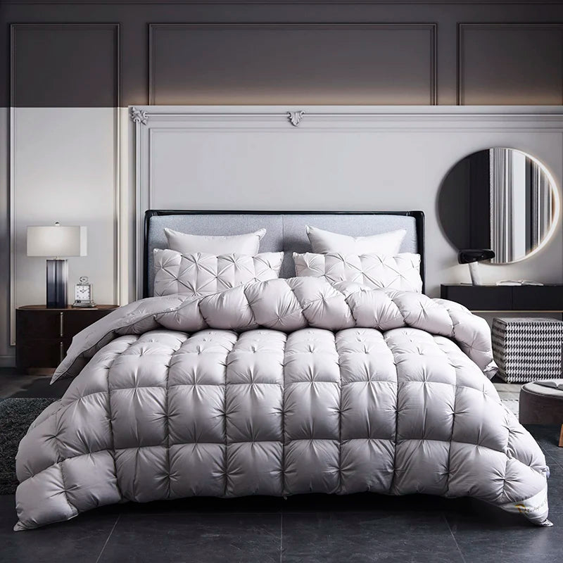 Gray comforter set on a bed in a modern bedroom setting