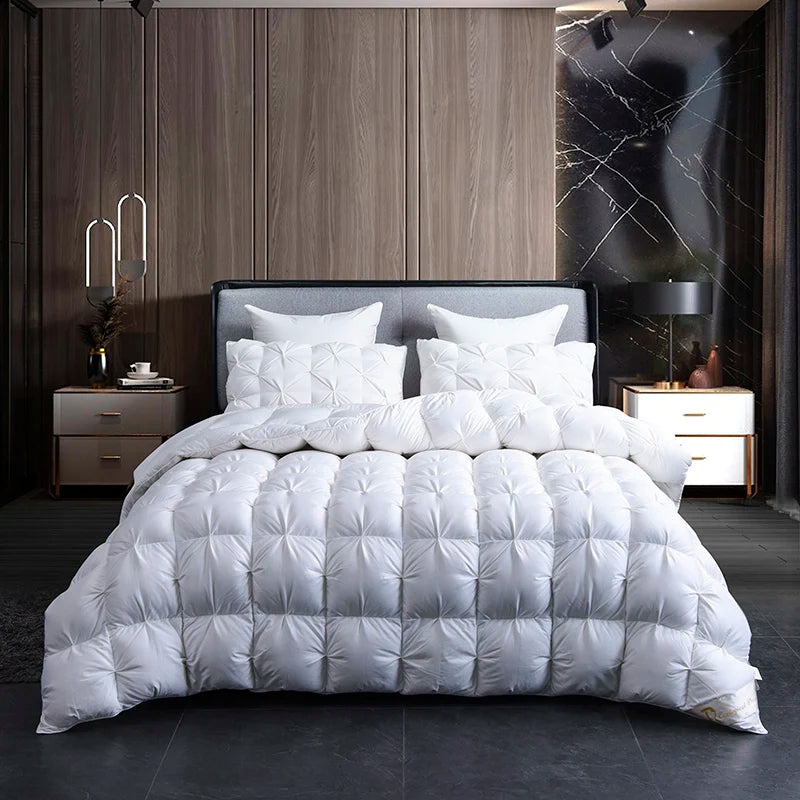 White quilted comforter on a bed in a modern bedroom setting with wooden panels and marble accents.