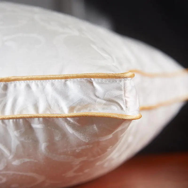 Close-up of a white ceramic teacup with a clear glass cover and wooden handle.