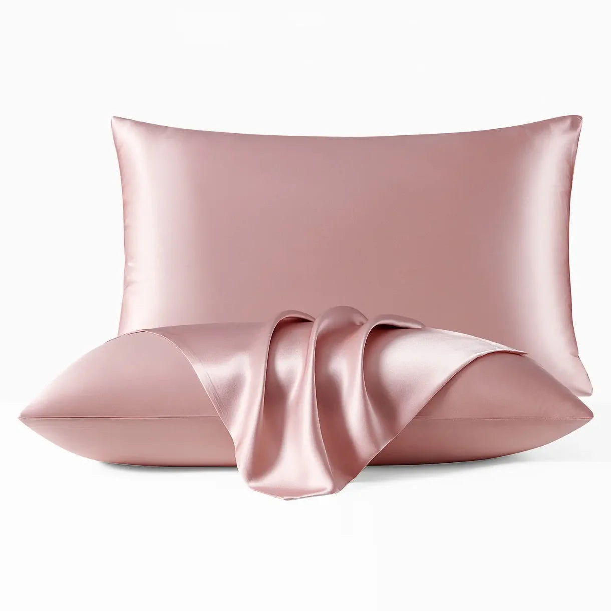 Pink satin pillow with a ribbon on a white background