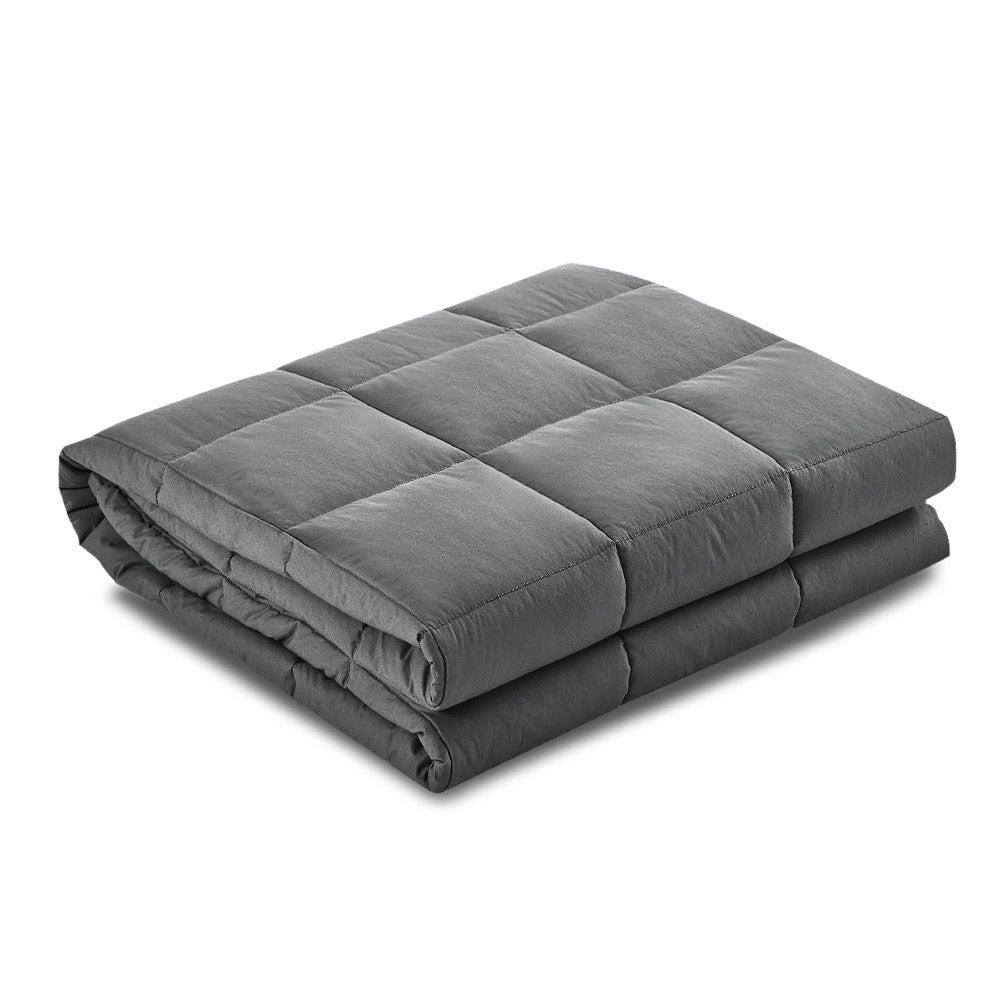 Folded gray weighted blanket on a white background